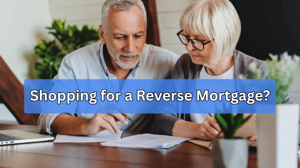 Senior couple reviewing reverse mortgage offers with advisor